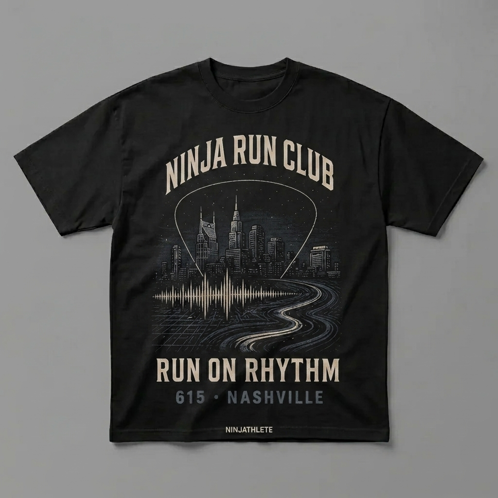 Nashville 615 black oversized running t-shirt featuring the Nashville skyline, the AT&T Building and a music-wave route and the words Run on Rhythm by Ninja Run Club